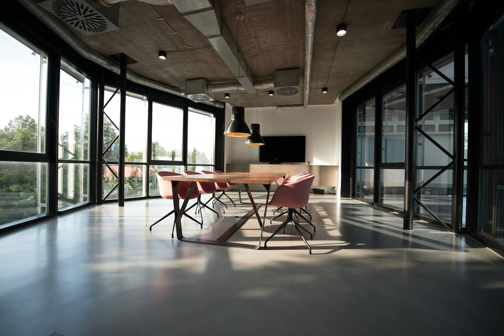 Professional meeting room with integrated AV systems and Q-SYS control panel
